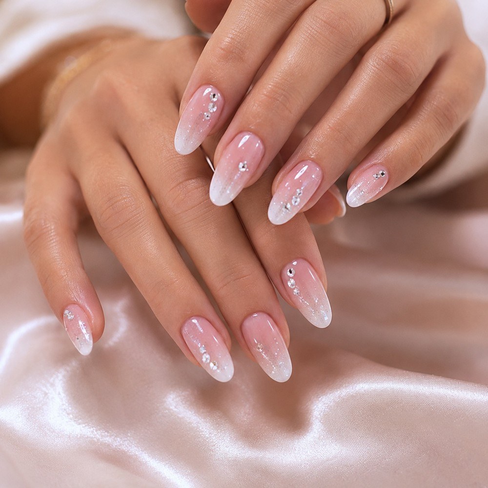 Customer photo — pink ombré nails with crystals, both hands